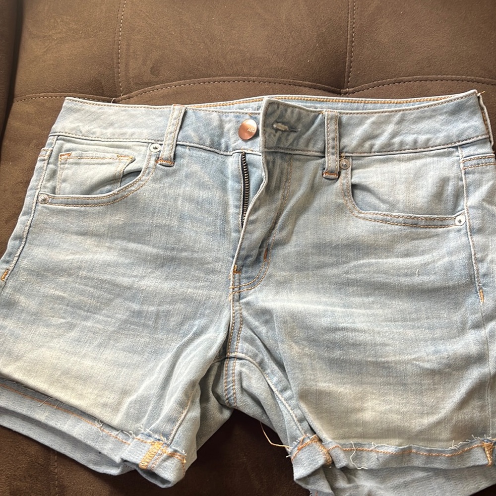 Selling size 10 American eagle light jean midi shorts